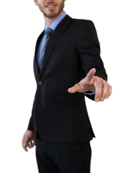 Homem de negócios em terno tocando dedo indicador — Fotografia de Stock