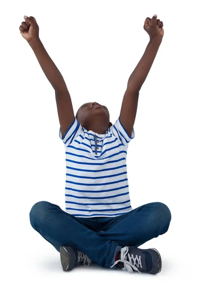 Excited boy sitting on floor — Stock Photo, Image