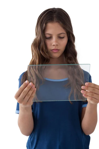 Girl using a glass digital tablet — Stock Photo, Image