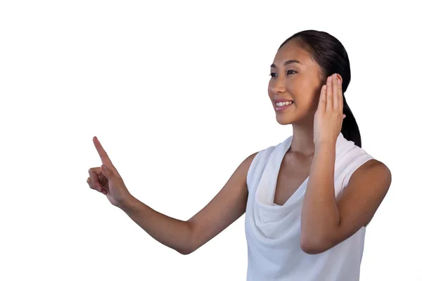 Businesswoman pretending to answer call while touching invisible interface — Stock Photo, Image