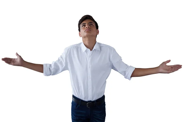 Teenage boy standing with hands raised — Stock Photo, Image