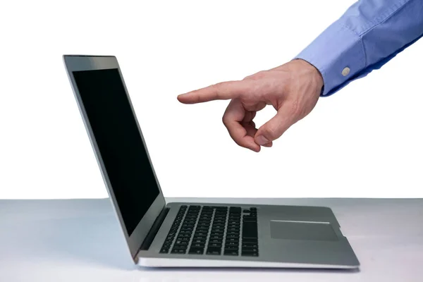 Businessman pointing on laptop computer — Stock Photo, Image