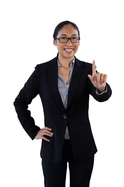 Businesswoman touching invisible interface — Stock Photo, Image