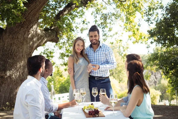 Group of friends interacting with each other — Stock Photo, Image