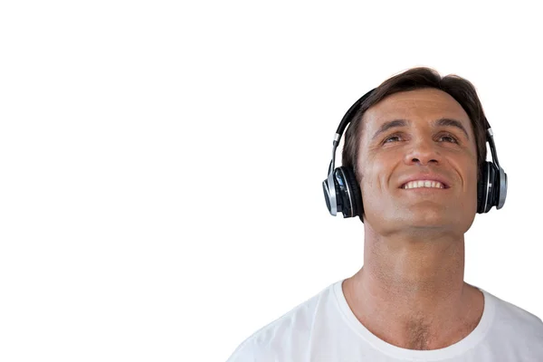 Feliz hombre maduro con auriculares mirando hacia arriba — Foto de Stock