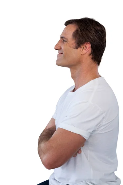 腕を持つ成熟した男の笑みを浮かべての側面図の交差 — ストック写真