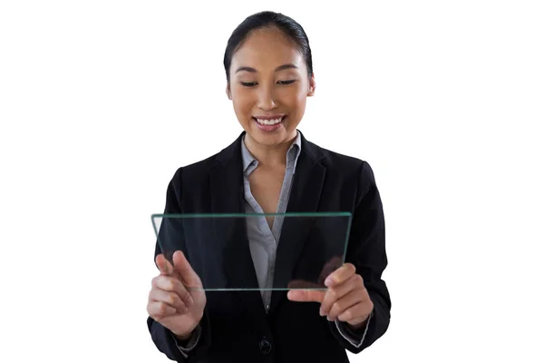 Businesswoman holding glass interface — Stock Photo, Image