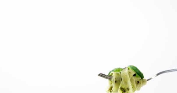 Close-up of cooked pasta with capsicum on fork — Stock Video