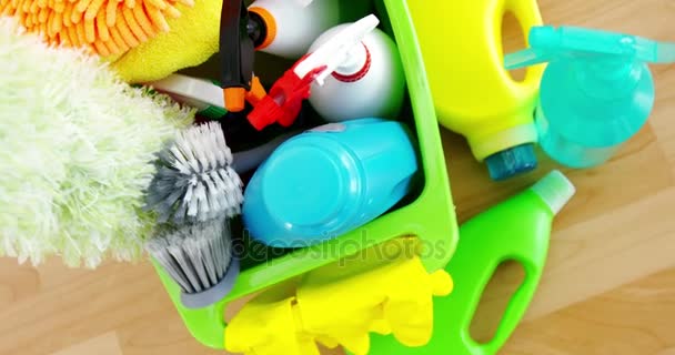 Various housekeeping supplies in a bucket — Stock Video