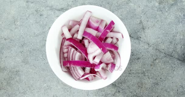 Chopped red onions in bowl — Stock Video