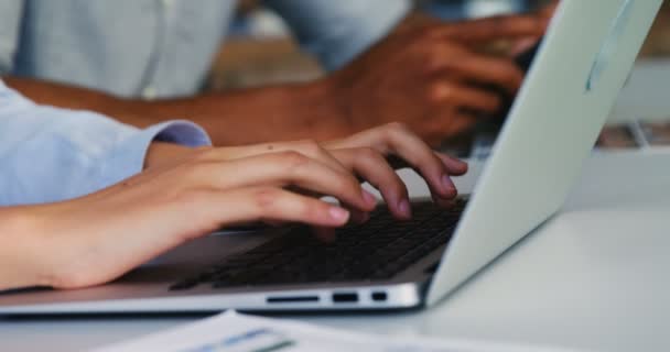 Close-up of business executives using laptop, digital tablet — Stock Video