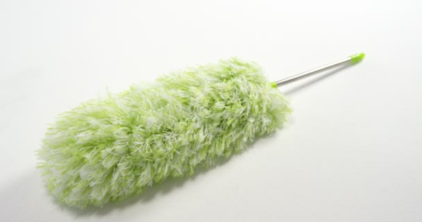 Close-up of green cleaning duster — Stock Video