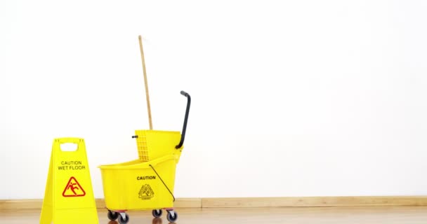 Mopping bucket with caution sign — Stock Video