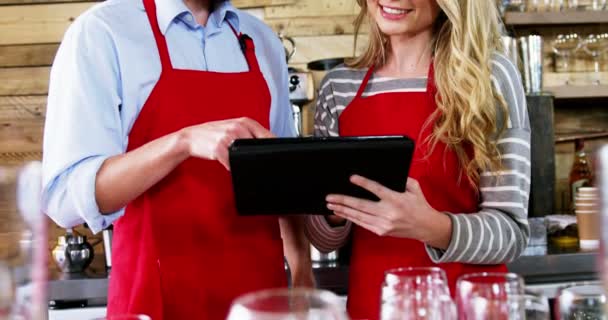 Waiter and waitress using digital tablet — Stock Video