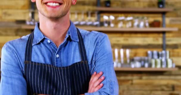 Smiling waiter standing at counter — Stock Video