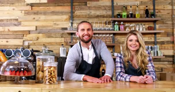 Waiter and waitresses standing at counter — Stock Video