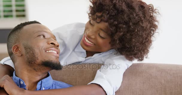 Woman embracing man in living room — Stock Video