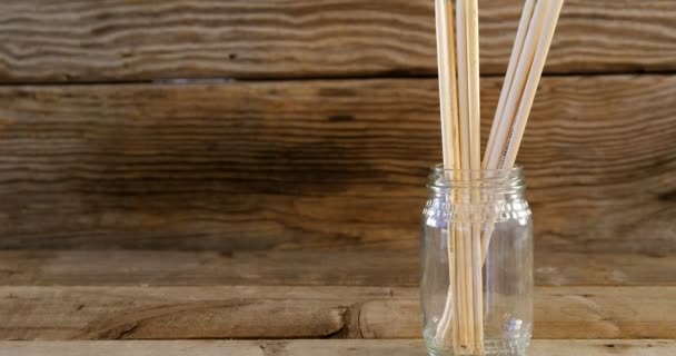 Various paint brushes on wooden table — Stock Video