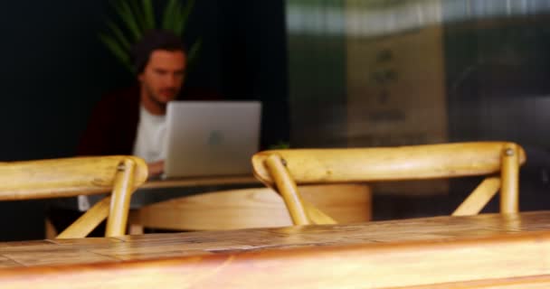 Open sign board with cup of coffee on table — Stock Video