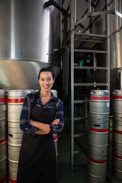 Confident worker by storage tank — Stock Photo, Image