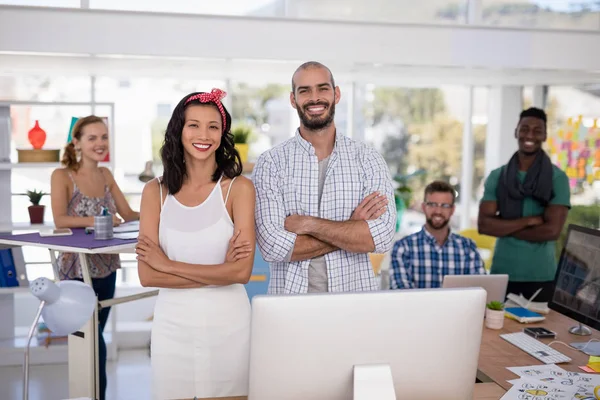 Executives standing together in the office — Stock Photo, Image