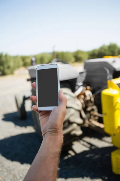 Hand holding mobile phone — Stock Photo, Image