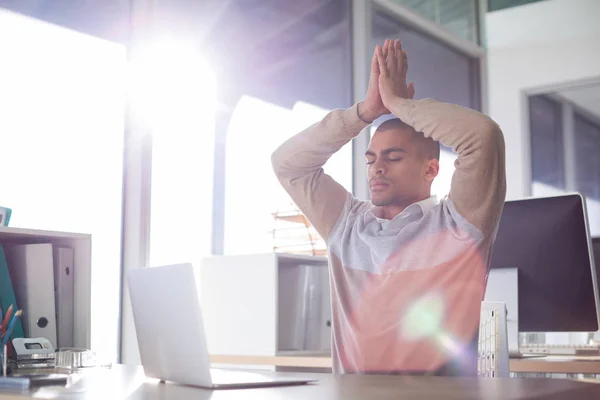 Male executive doing yoga — Stock Photo, Image