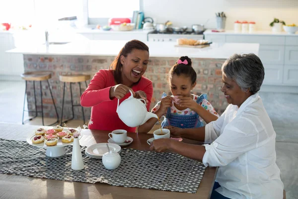 Multi-generation family having tea — Stock Photo, Image