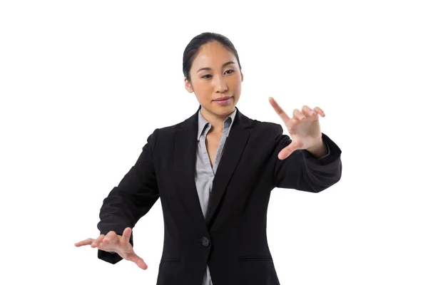 Businesswoman pressing an invisible virtual screen — Stock Photo, Image