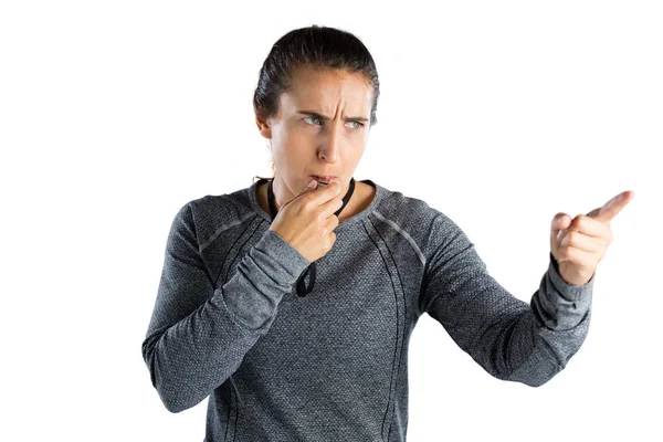 Female coach gesturing while whistling — Stock Photo, Image