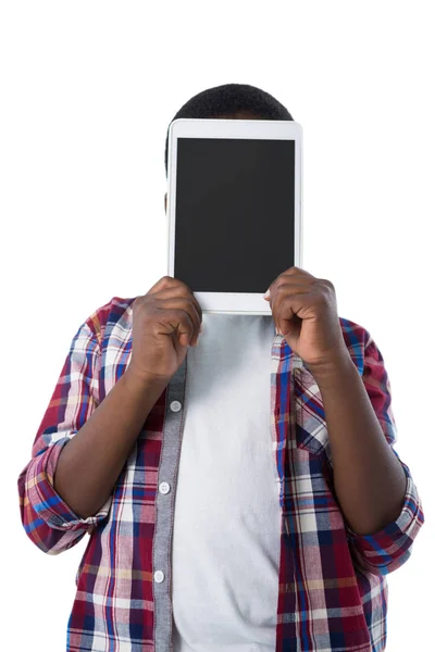 Niño escondiendo su cara detrás de la tableta —  Fotos de Stock