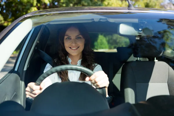 Beautiful woman driving a car — Stock Photo, Image