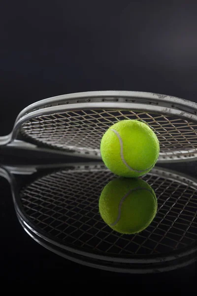 Tennis racket on ball with reflection — Stock Photo, Image