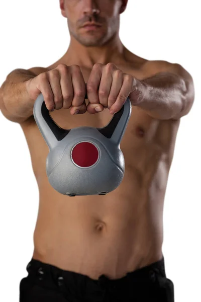 Shirtless sportsman exercising with kettle bell — Stock Photo, Image