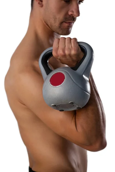 Shirtless sports man exercising with kettle bell — Stock Photo, Image