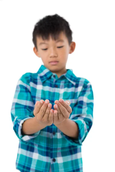Boy pretending to hold invisible object — Stock Photo, Image