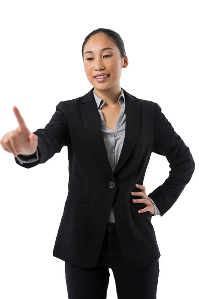 Businesswoman pressing an invisible virtual screen — Stock Photo, Image