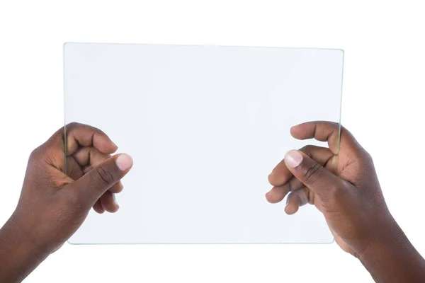 Mão segurando um tablet digital de vidro — Fotografia de Stock