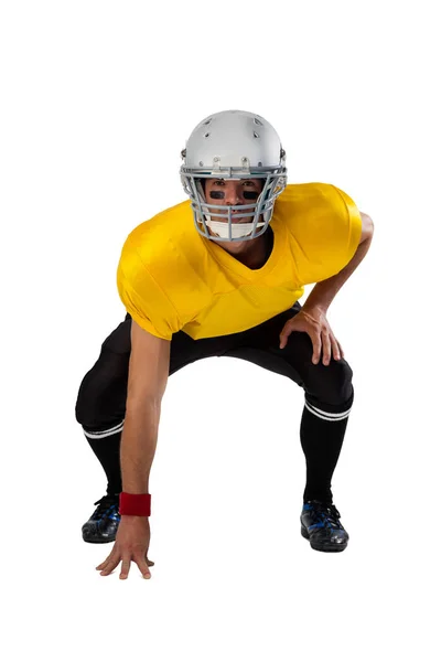 Americký fotbalista nosí helmu ohýbání — Stock fotografie