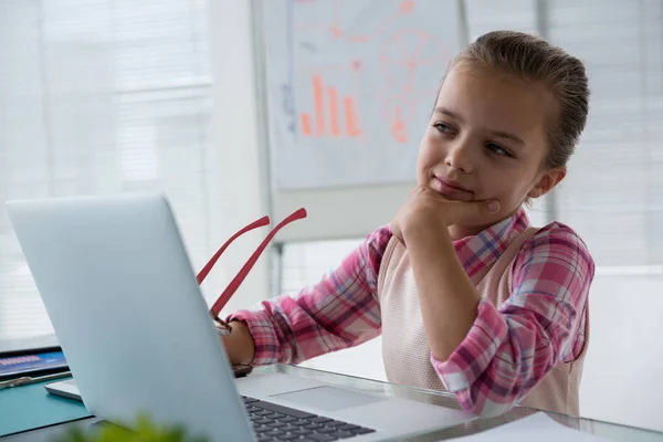 Girl as business executive using laptop — Stock Photo, Image