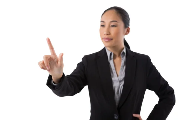 Businesswoman pressing an invisible virtual screen — Stock Photo, Image