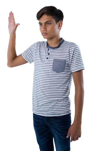 Adolescent garçon levant son la main — Photo