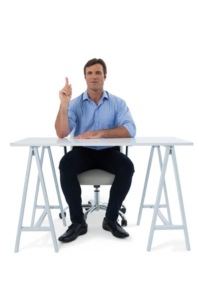 Male executive pressing an invisible virtual screen — Stock Photo, Image