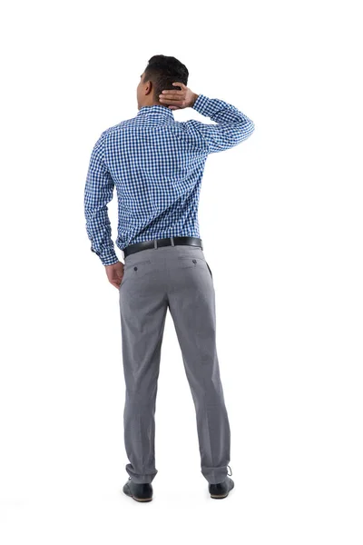 Homem pensativo em pé sobre fundo branco — Fotografia de Stock