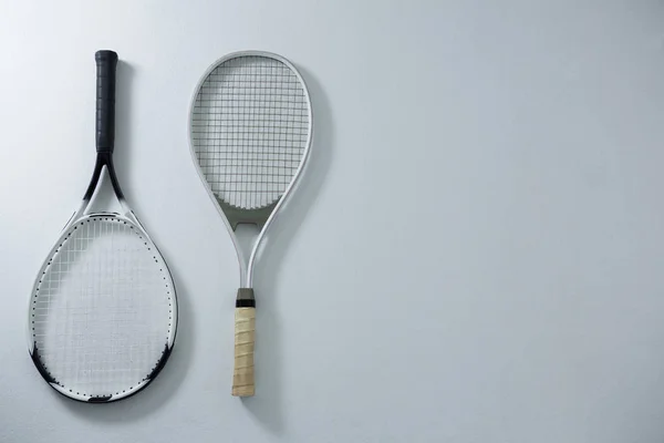 Overhead view of metallic tennis rackets — Stock Photo, Image