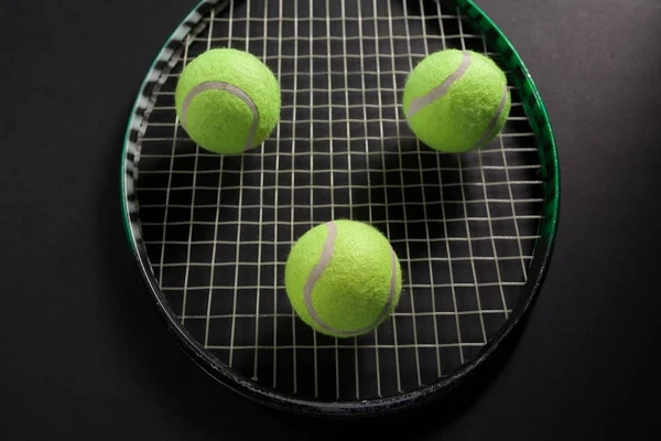 Balls on tennis racket — Stock Photo, Image