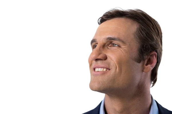 Businessman smiling against white background — Stock Photo, Image