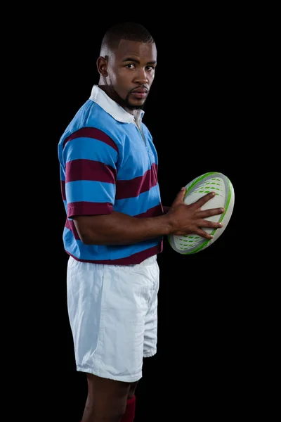 Male player holding rugby ball — Stock Photo, Image