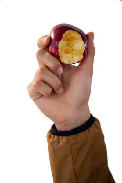 Mão segurando maçãs comidas — Fotografia de Stock