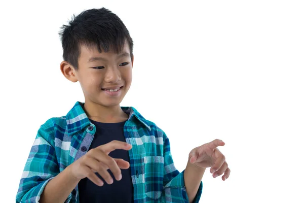 Chico fingiendo tocar una pantalla invisible — Foto de Stock